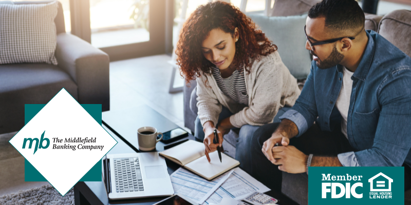 Couple looking over financial reports together